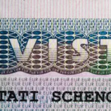 A close-up of an Italian visa symbolizing the personal bilingual assistance we offer for Italian visa, residency permit and paperwork in Tuscany.