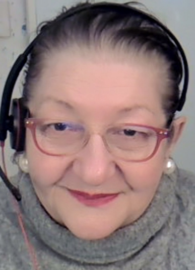 Close-up portrait of Elena Nissen Villoresi, founder and lead translator of Italy-America Certified Language Services. She has dark hair, fair skin and is smiling.