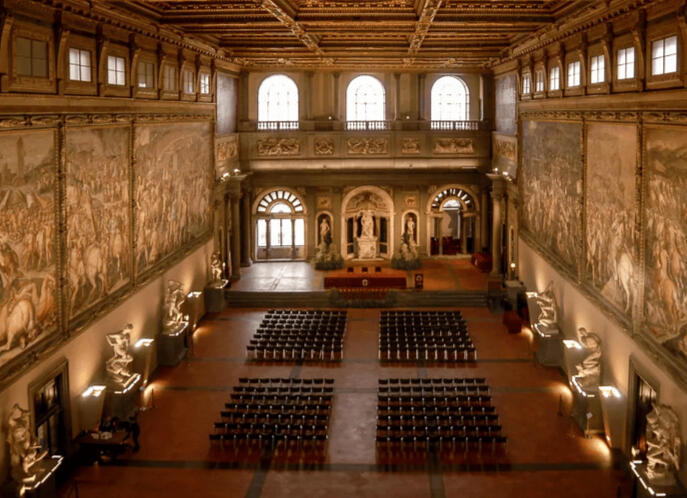 The Hall of the 500 in Florence City Hall with statues by Michelangelo and frescoes by Vasari is an incredible venue for a wedding in Tuscany.