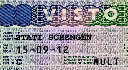 Open passport showing Schengen visa and entry stamp obtained through the certified Italian translations of personal records.